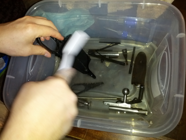 Mosin Pieces being cleaned in Mineral Spirits