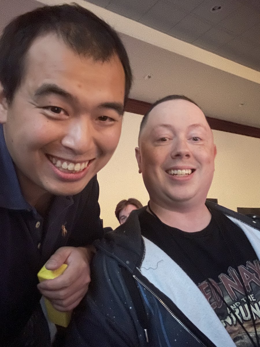 Two Attendees Posing for a Photo