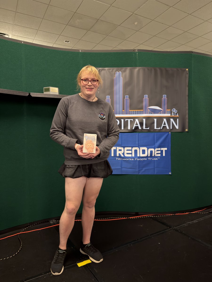 Person holding a prize at Capital LAN