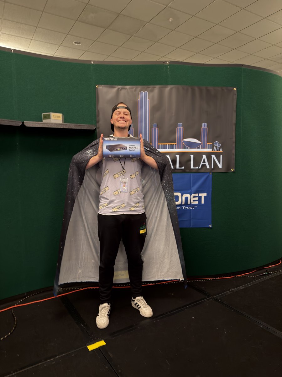 Person holding a network switch box on stage