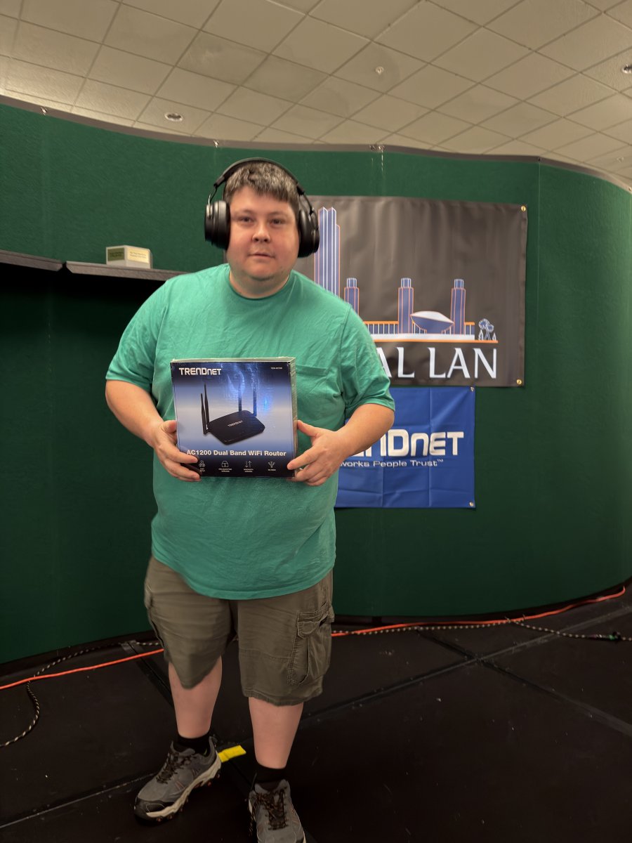 Attendee holding a boxed WiFi router