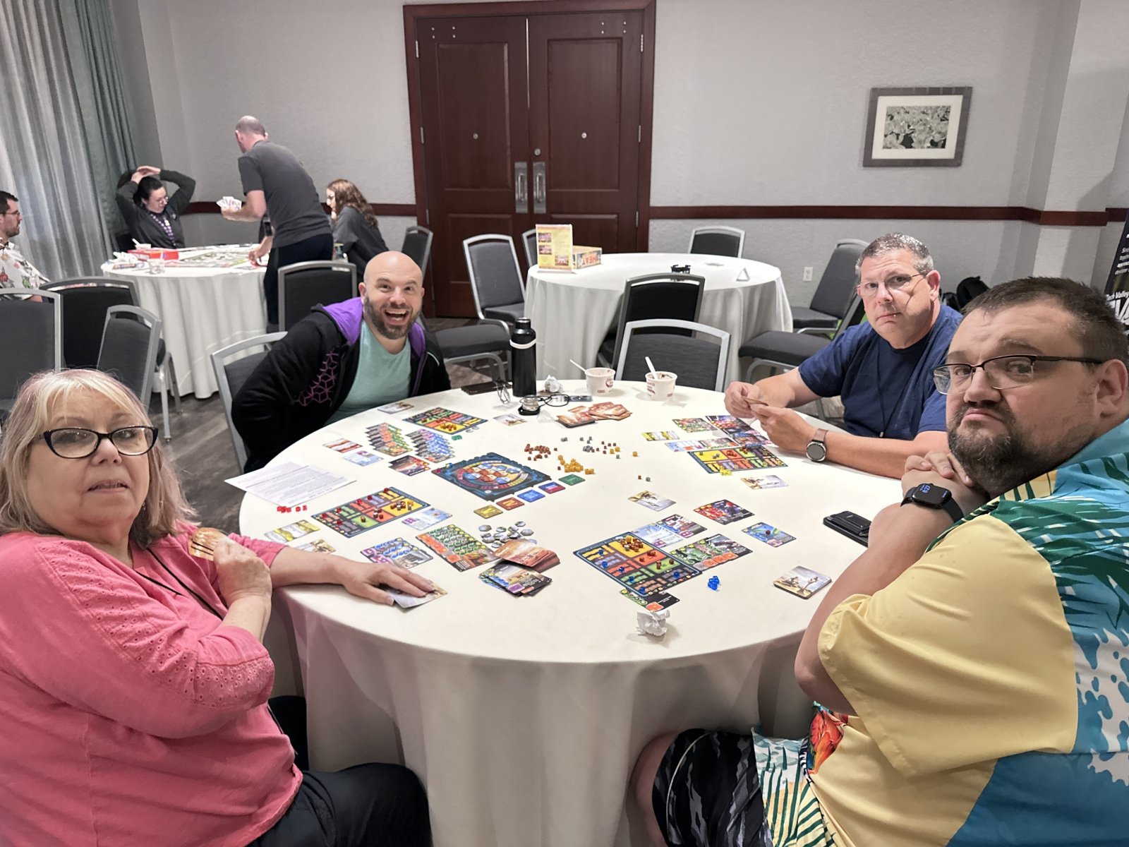 Group playing board game at round table