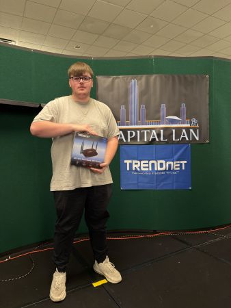 Attendee holding TRENDnet router prize