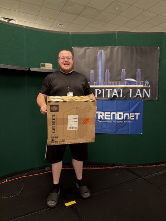 Attendee holding boxed computer case