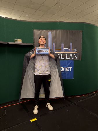 Person holding a network switch box on stage