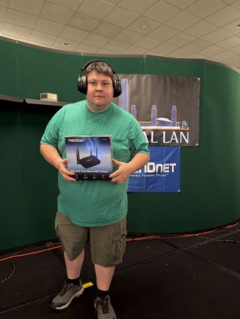 Attendee holding a boxed WiFi router