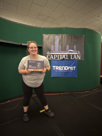 Attendee holding a computer power supply prize