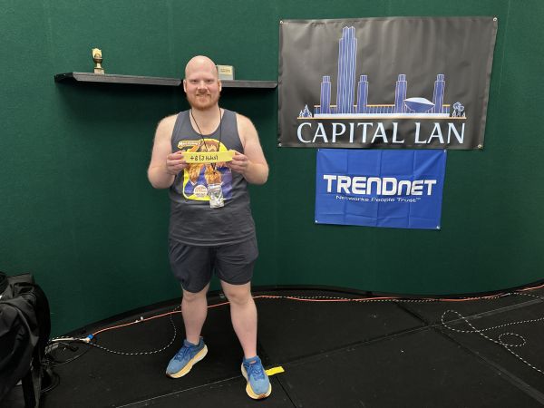 Attendee holding a yellow score marker