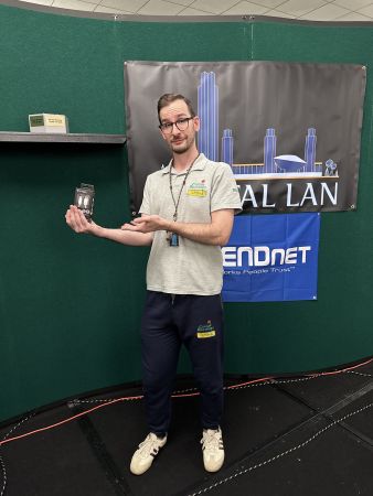 Attendee presenting a prize on stage