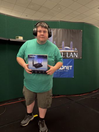 Attendee holding a boxed WiFi router