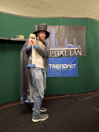 Person in wizard costume holding small box