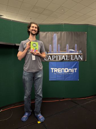 Attendee holding a Point Salad board game