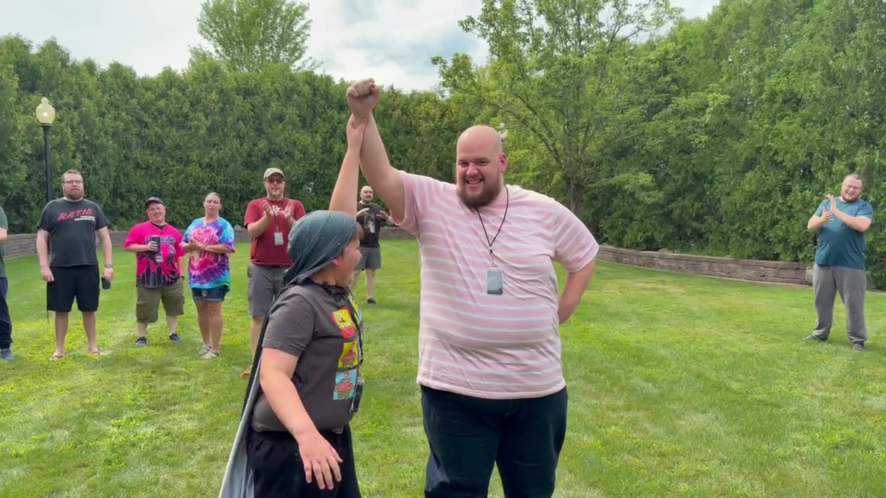 Outdoor arm wrestling victory celebration