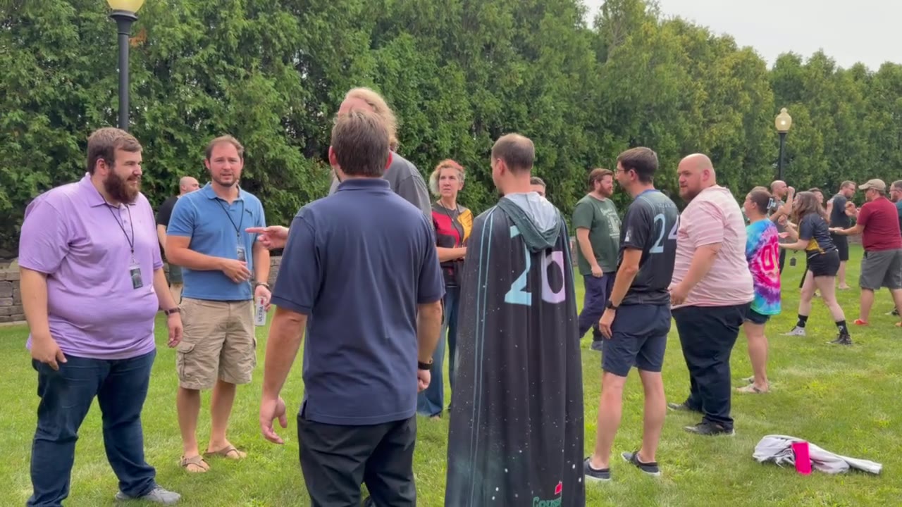 Outdoor group gathering on grass field